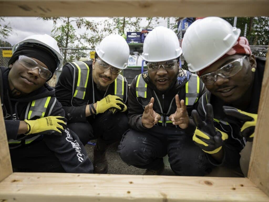 Building Futures pre-apprenticeship trainees in hard hats and safety glasses
