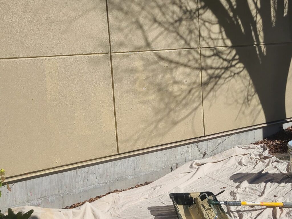Exterior wall repainted after graffiti removal at UW