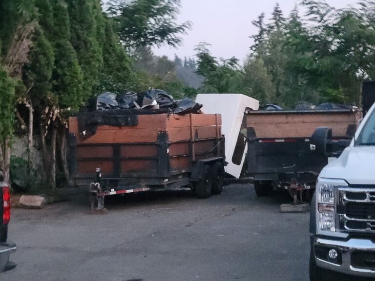 Two loaded Fresh Family dump trailers ready for haul off