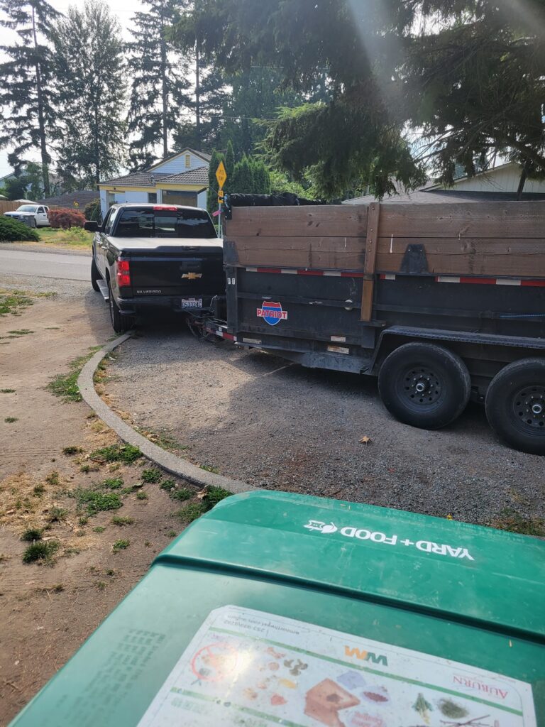 Fresh Family truck with dump trailer at a job
