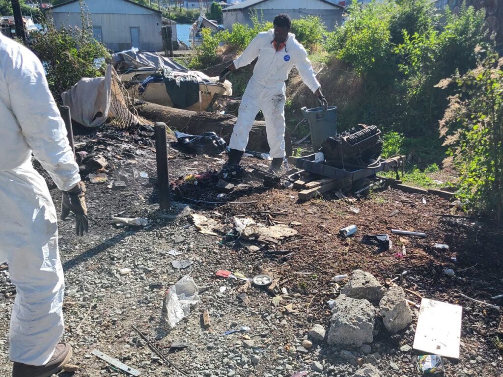 Fresh Family crew in protective suits cleaning up a contaminated site