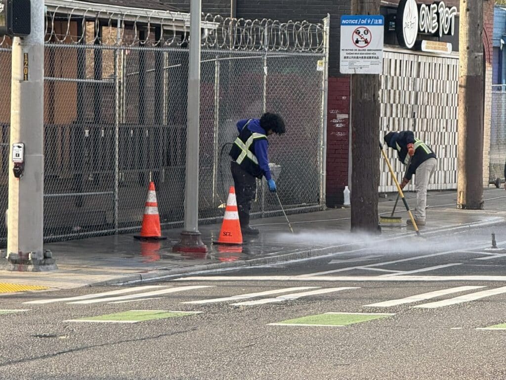 Fresh Family crew pressure washing sidewalks in Seattle Little Saigon for SDOT