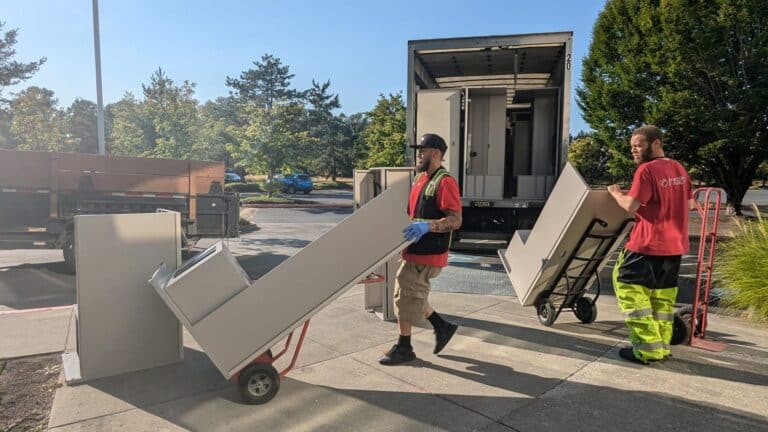 Fresh Family crew loading office furniture onto a moving truck