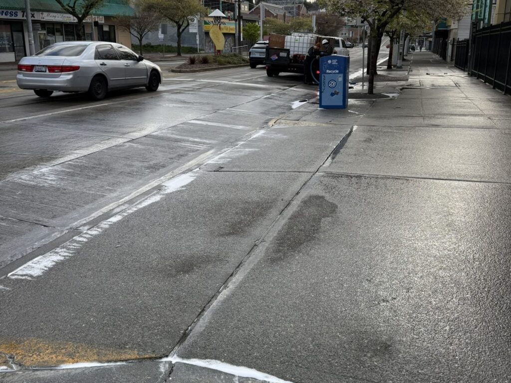 Freshly washed street curb and sidewalk in Little Saigon, Seattle