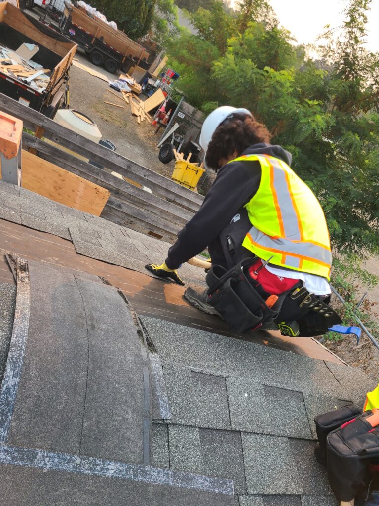 Trainee working on the tiny home roof