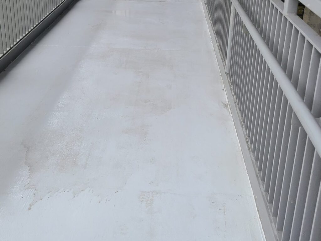 Clean walkway ramp after pressure washing at UW Bothell