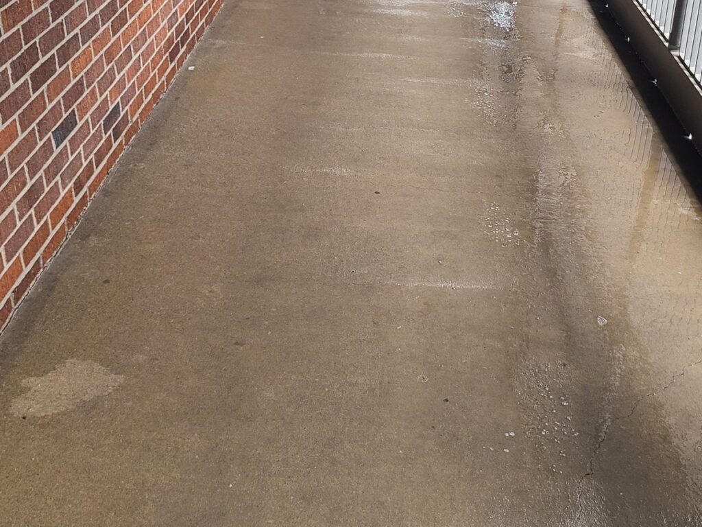 Crew washing a covered walkway at UW Bothell